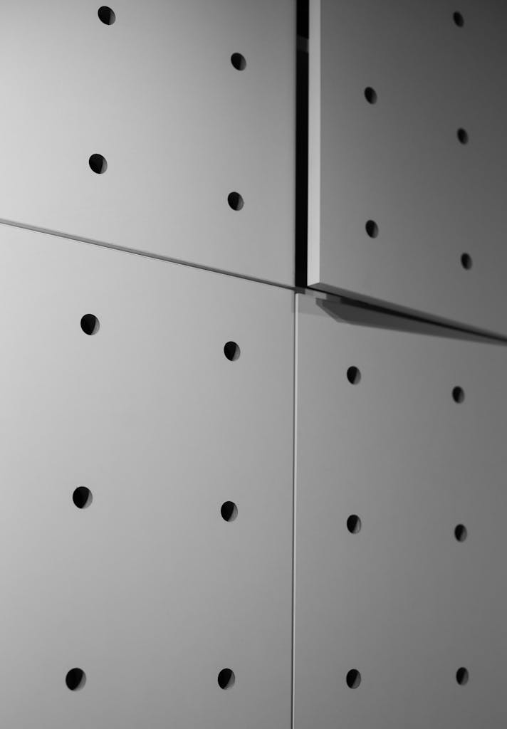 Close-up view of perforated wall panels for acoustic improvement.